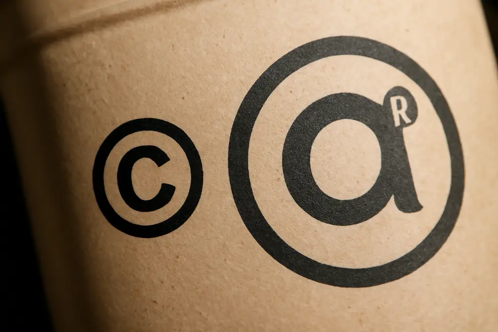 Visual comparison of copyright protecting creative work and trademark safeguarding brand identity.